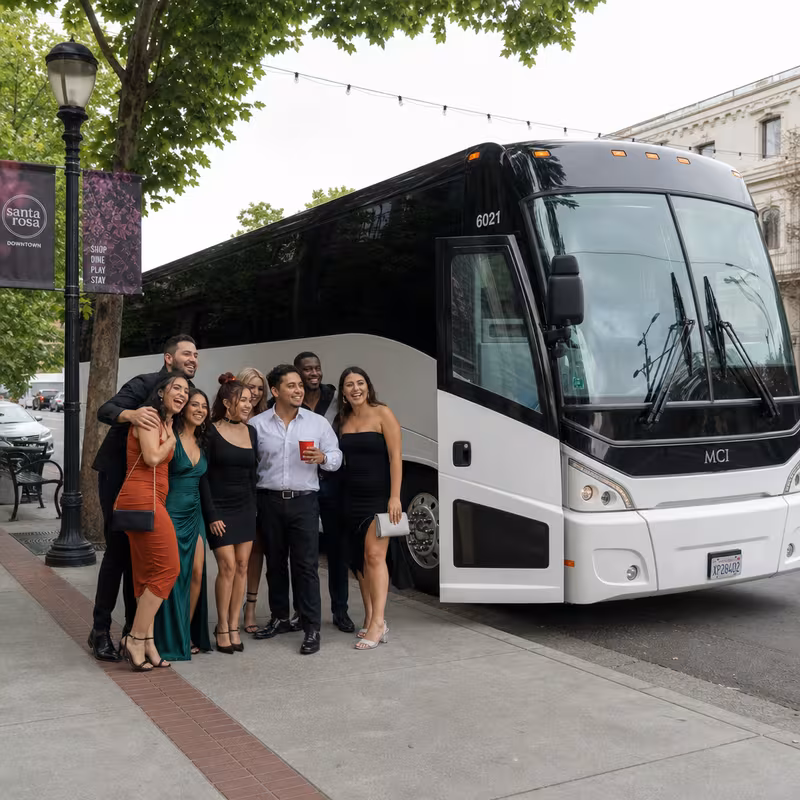 Passengers loading luggage while boarding an Santa Rosa group shuttle
