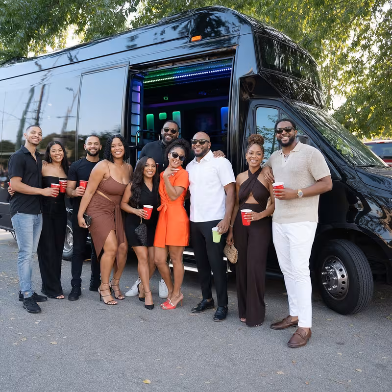 Group boarding a white charter bus for Birthday Transportation transportation in Santa Rosa