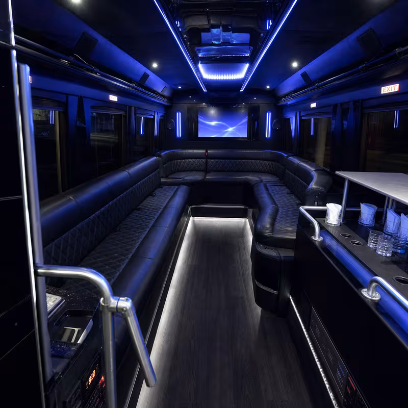 Party bus interior with wraparound leather seating and LED lighting in Santa Rosa