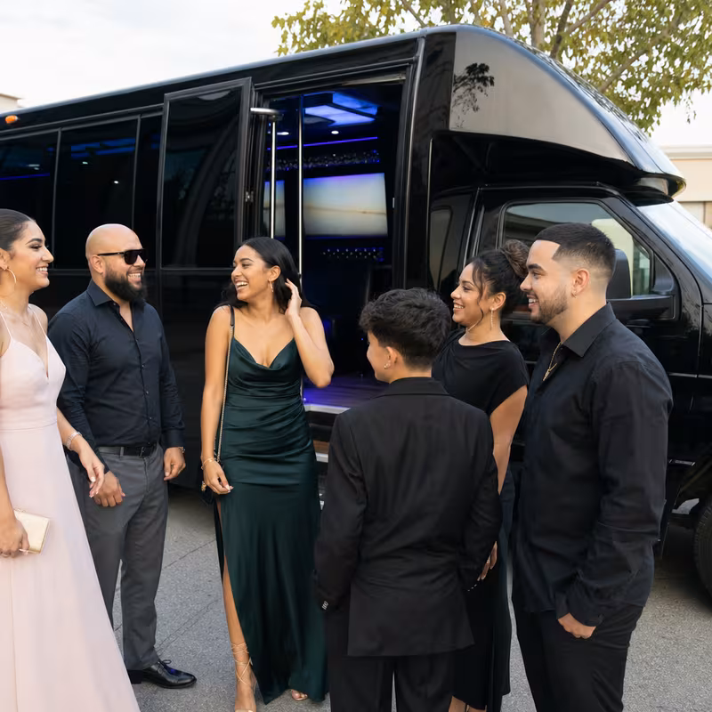 Passengers loading luggage while boarding an Santa Rosa group shuttle