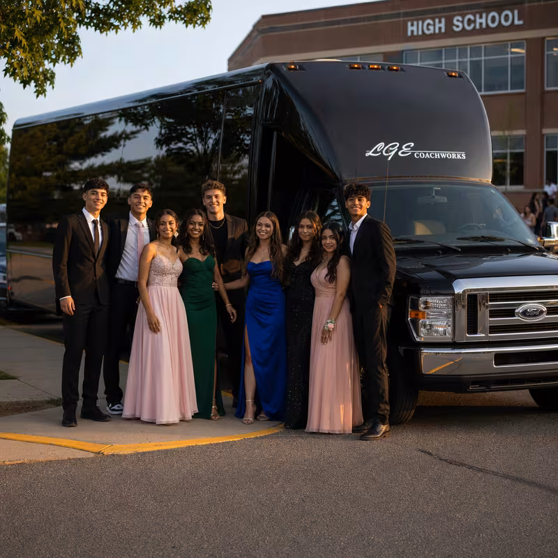 Group boarding a white charter bus for Prom & Homecoming Transportation transportation in Santa Rosa