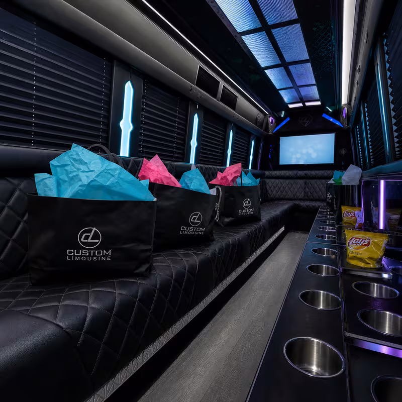 Party bus interior with wraparound leather seating and LED lighting in Santa Rosa